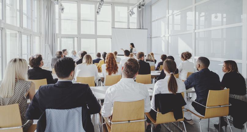 A talk in a large windowed room