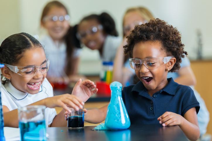 Two primary school students doing a science experiment