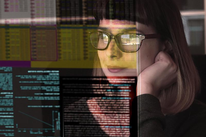 Female academic reading on a screen
