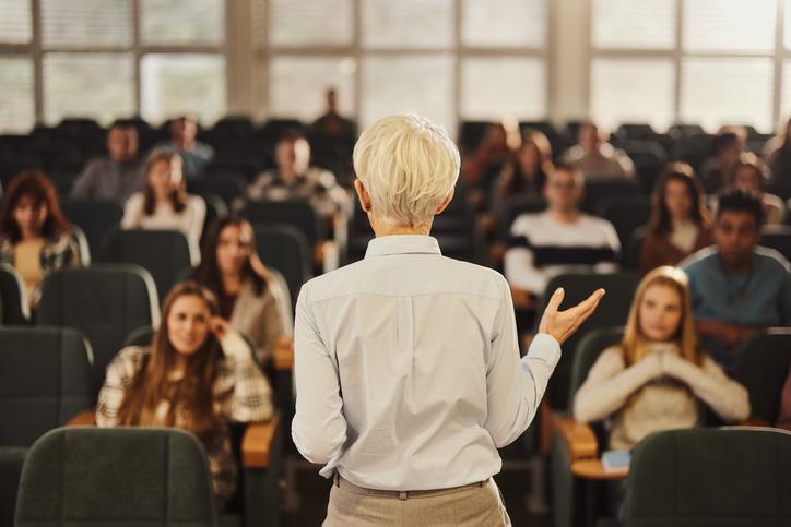 A teacher gives a lecture 