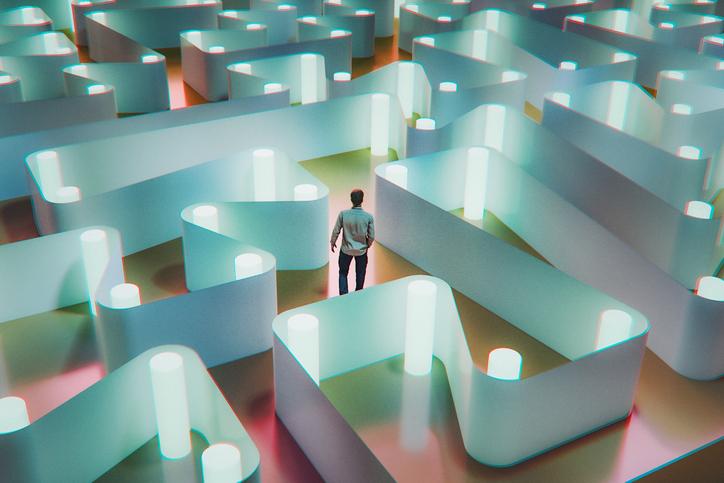 Man tries to find his way through a maze