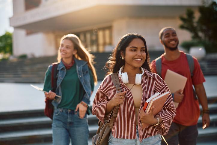Students walk happily across campus