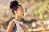 Young woman meditating outdoors