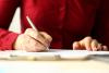 Woman signing document