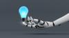 A robot hand holds a lightbulb