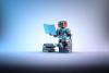 A toy robot sits on a stack of books