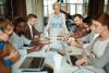 A meeting takes place around a long table