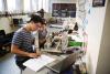 Two engineering students work together on a project