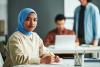 Young Muslim female student in university classroom