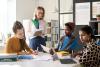 An educator talks to international students