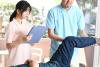 Two physiotheraphy students work with a patient