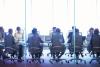 A team sat around a boardroom table