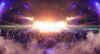 A concert crowd and strobe-lit stage