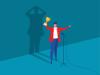 An illustration of a man celebrating an achievement while his shadow despairs behind him