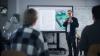 A teacher explains a circuit board to a class