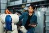 A woman building a robot