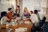 A team brainstorming around a large table