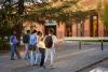 A group of students outside a campus building
