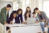 A group of students work together