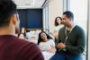 A teacher addresses a classroom informally
